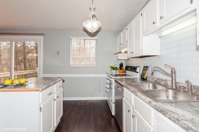 kitchen with white cabinetry, sink, decorative backsplash, hanging light fixtures, and electric stove