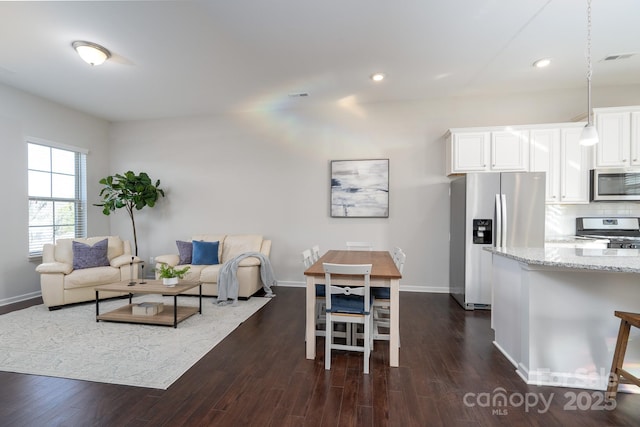 living room with dark hardwood / wood-style floors