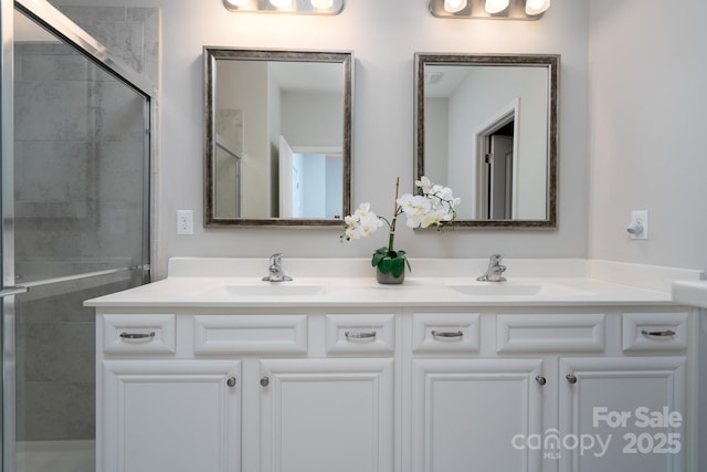 bathroom with walk in shower and vanity