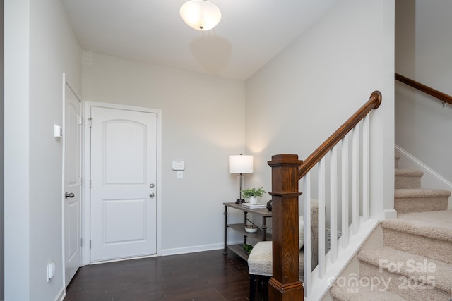 foyer with dark hardwood / wood-style floors