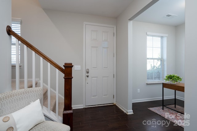 foyer with dark wood-type flooring