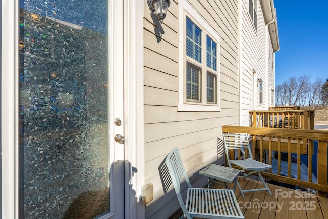 doorway to property featuring a wooden deck