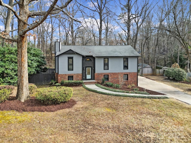 raised ranch featuring a front yard