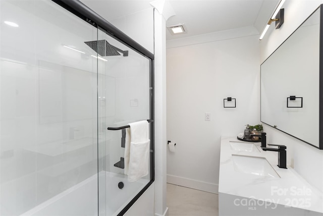 bathroom with bath / shower combo with glass door and vanity