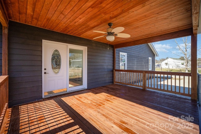 wooden deck with ceiling fan