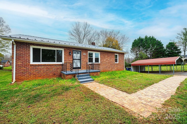 view of front facade featuring a front lawn and a carport