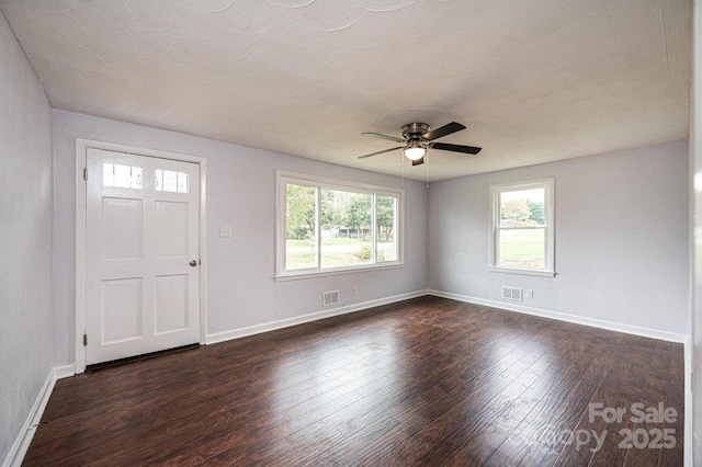 entryway with ceiling fan and dark hardwood / wood-style flooring