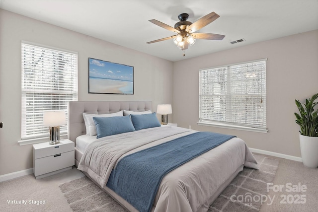 bedroom with carpet floors, visible vents, and baseboards