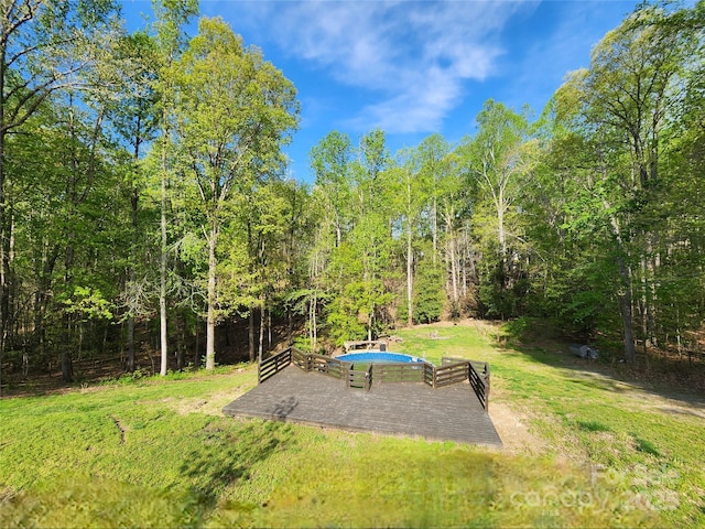 view of yard with a forest view