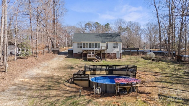 888 Brevard Place Rd, Iron Station, NC 28080 - rear view of property with stairs, a deck, and an outbuilding