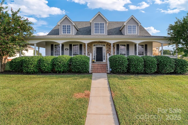 view of front facade with a front lawn and a porch