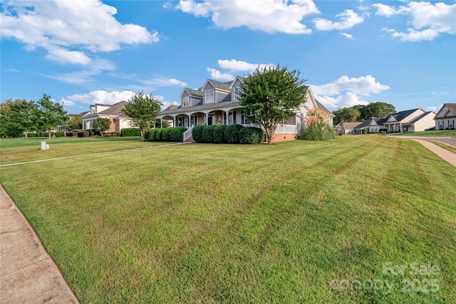 cape cod home with a front yard