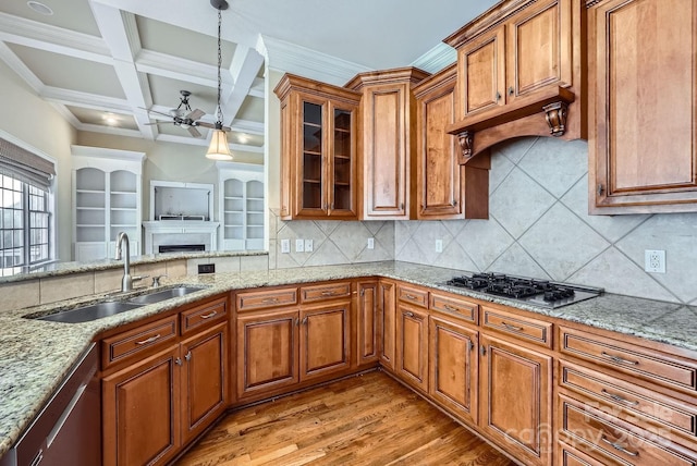 kitchen with sink, coffered ceiling, tasteful backsplash, and appliances with stainless steel finishes