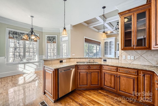 kitchen with pendant lighting, beamed ceiling, sink, stainless steel dishwasher, and coffered ceiling