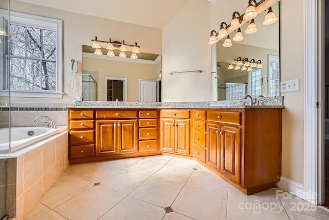 bathroom with vanity, tile patterned floors, and separate shower and tub