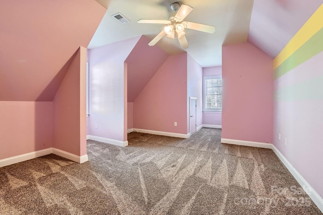 additional living space featuring ceiling fan, carpet, and lofted ceiling