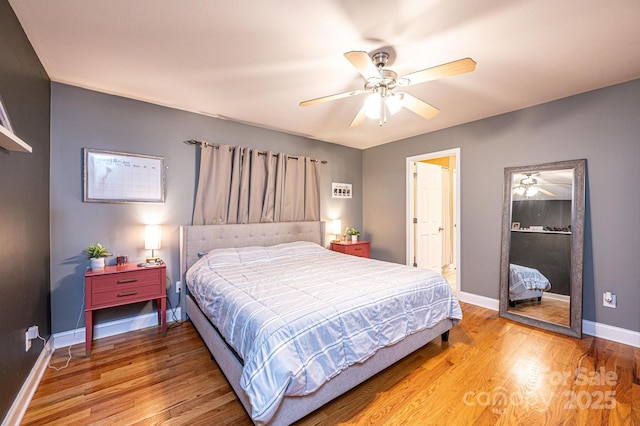 bedroom featuring hardwood / wood-style flooring and ceiling fan