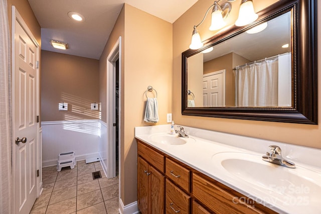 bathroom with vanity and tile patterned flooring