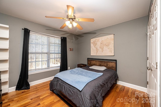 bedroom with wood-type flooring and ceiling fan