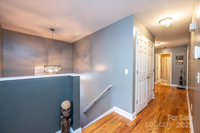 hallway with wood-type flooring