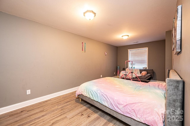 bedroom featuring hardwood / wood-style flooring