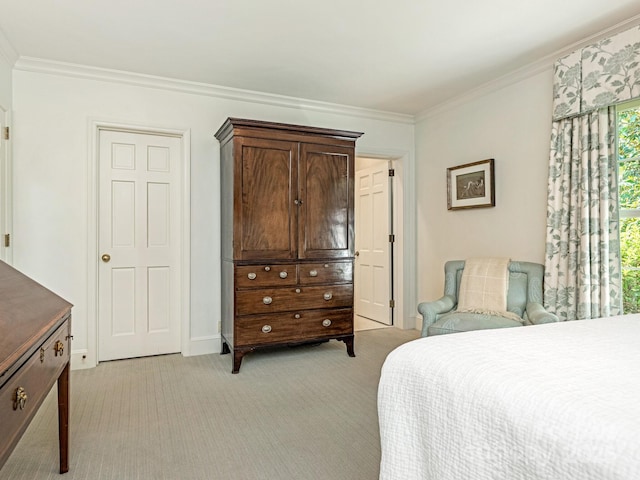 bedroom featuring baseboards, ornamental molding, and light colored carpet