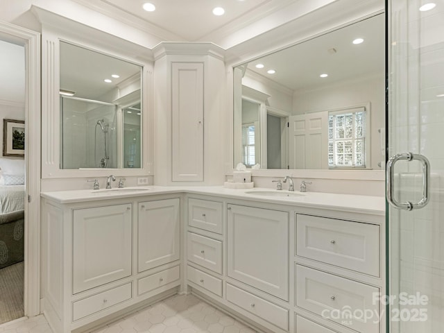 full bath with a sink and crown molding