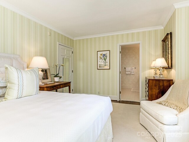 bedroom with crown molding and wallpapered walls