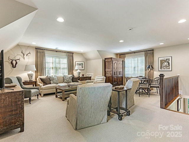 living room with light carpet, lofted ceiling, and recessed lighting