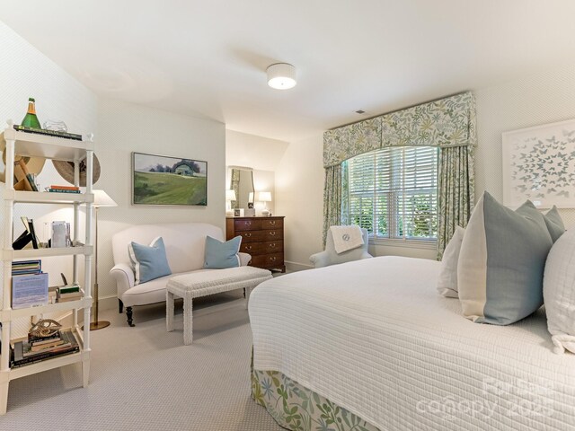 bedroom featuring carpet floors and baseboards