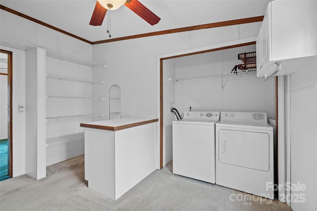 clothes washing area featuring separate washer and dryer, light carpet, and ceiling fan