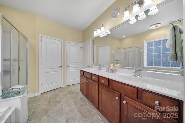 bathroom with walk in shower, tile patterned floors, and vanity