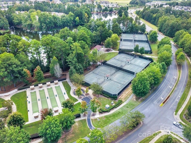 birds eye view of property with a water view