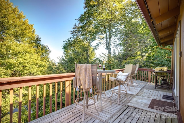 wooden deck featuring grilling area