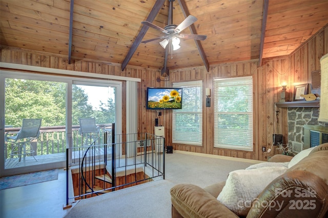 living room with carpet flooring, wood ceiling, wooden walls, and lofted ceiling with beams