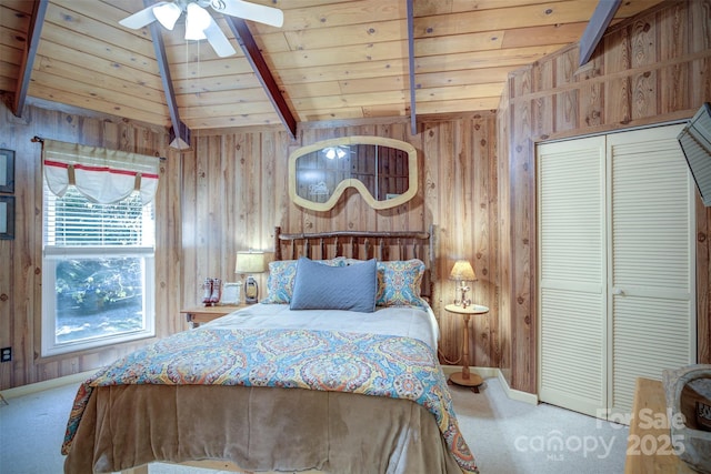 unfurnished bedroom with carpet, vaulted ceiling with beams, a closet, and wooden ceiling