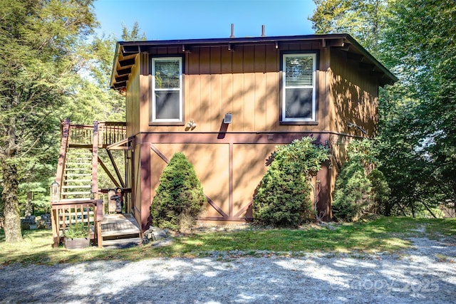 view of property exterior featuring a wooden deck