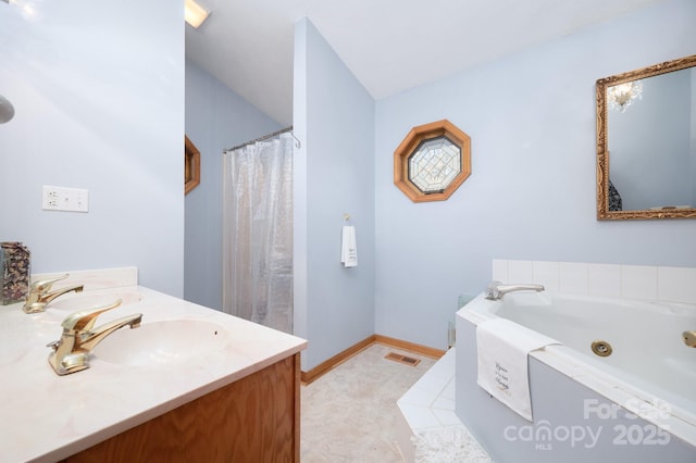 bathroom with vanity and a washtub