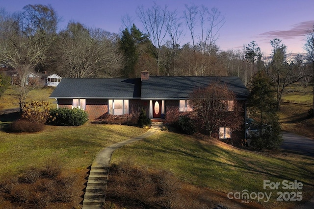 view of front of home featuring a yard