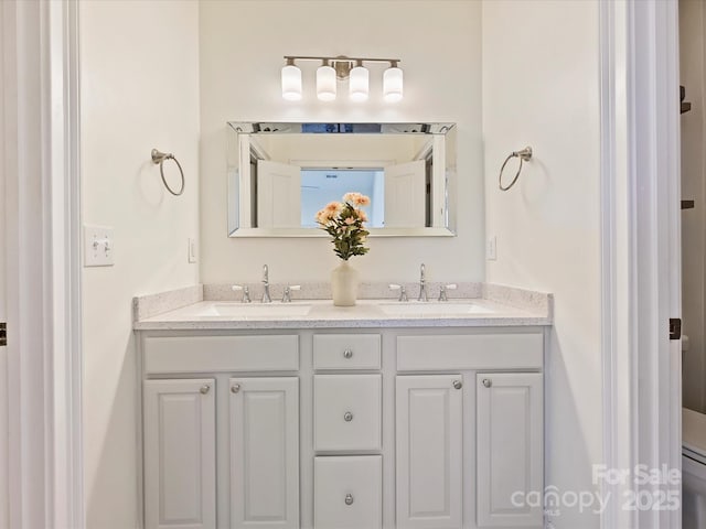 bathroom with toilet and vanity