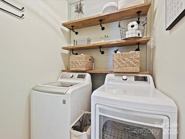 laundry area with independent washer and dryer