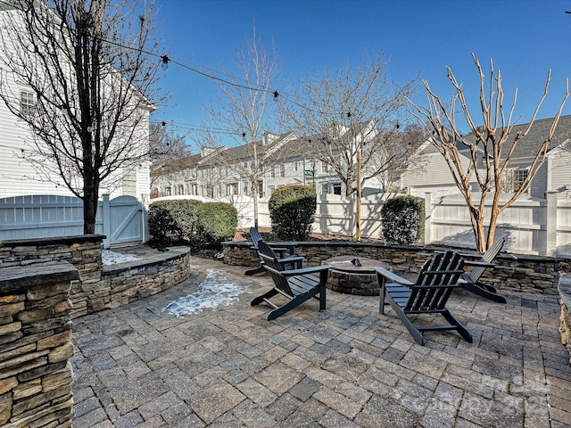 view of patio / terrace with an outdoor fire pit