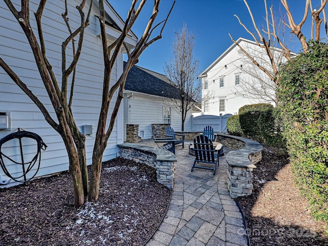 view of patio with a fire pit