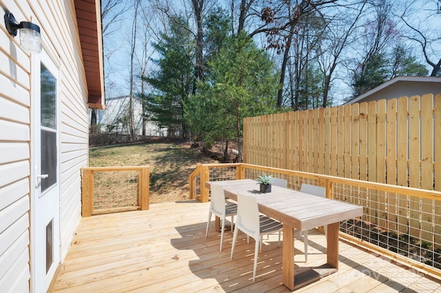 deck with fence and outdoor dining space