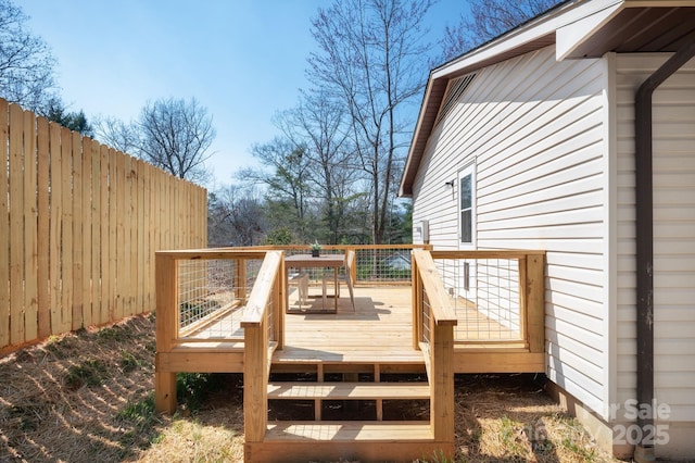 wooden deck featuring fence