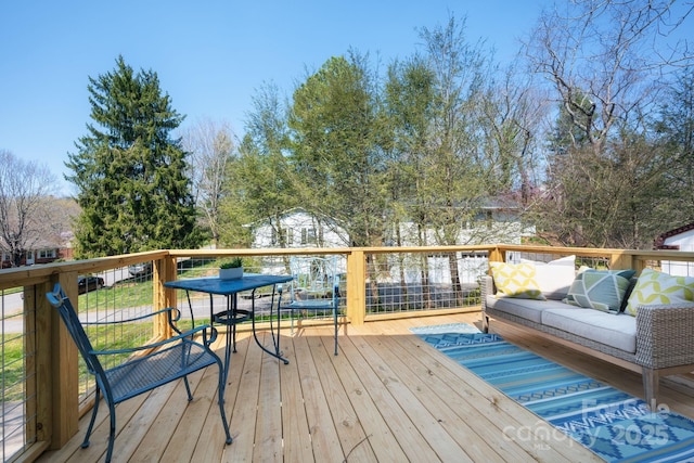 wooden deck with an outdoor hangout area