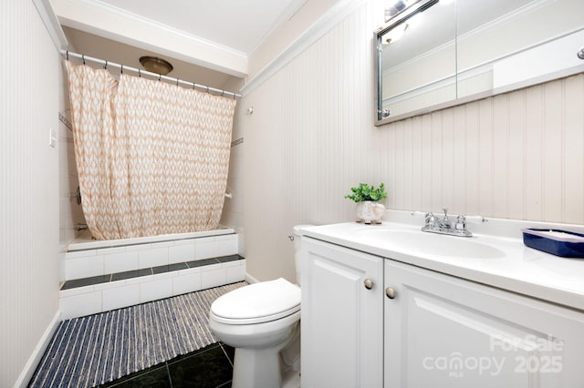 bathroom with tile patterned floors, toilet, vanity, ornamental molding, and tiled shower / bath