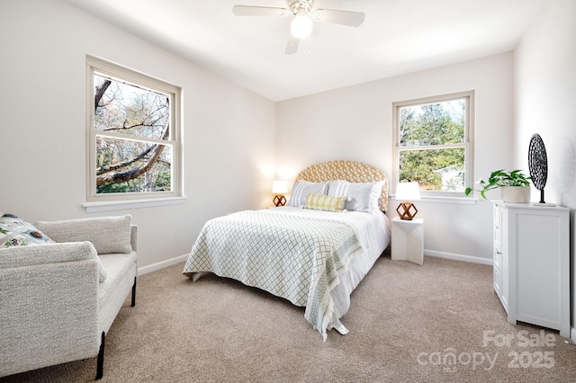 bedroom featuring baseboards, ceiling fan, and light colored carpet