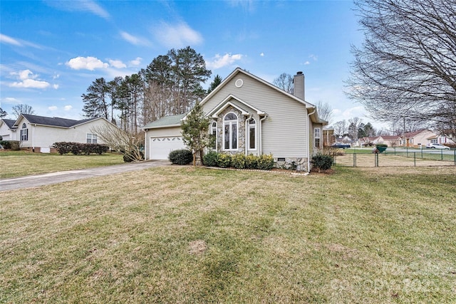 view of front of home featuring a garage and a front lawn