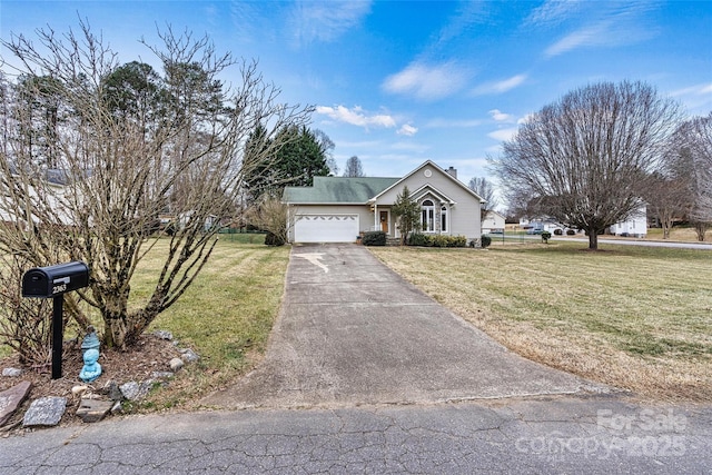 view of front of home with a garage and a front lawn